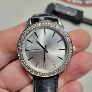 Ladies silver watch with sparkling diamond bezel , new battery
